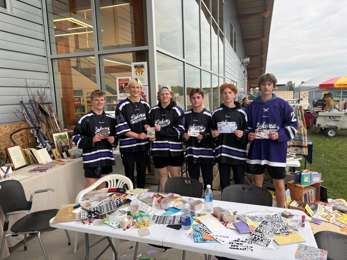 Fort Frances Lakers hockey players customizing notebooks in workshop
